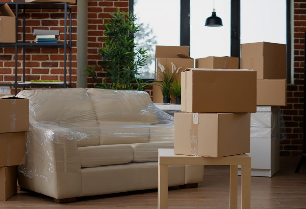 No people in living room interior to move in with carton boxes, empty real estate property full of cardboard packing storage cargo. Nobody in apartment for relocation and moving day. SSUCv3H4sIAAAAAAAAA01Qy27CMBD8FbTnWMoTYv6gh1a9ox7W9gasGhvZThGK8u/dQKD1aXd2PDs7E1gDe6io74dWopBb0qLtVCtUs+uE1HXXm76SpdxCAQYzwb5qaimrpq+qrq/qkl8BCpPVsJ/AOjemHDHb4GHPk0jeULyXZGwO0aLjbi4gZcxjosTfuNOsfeTpvX/qHaYFZ4NvPlO0ISZ2kUbFyLtNmpxDT2FMMBdP5geLRnrRPpmR0wa92eRI9J/54sD8VQAeyevb4mVeTDvCu7UDqEHWskYtSJco2l07CGw6KchIBoaurDrDUs1Qt0PZabFDKTnCnRRKlVpog2XdtiXh0APv+b7yJef16JBPSzbsKIw+x9vDlQvhgspx1AO6RAWcMCUmmBXgj5dotfXHNTpOPJwftQ95sX0/Lgf9bc266pH2yTK67JlgvLiAhsw6HtXZ5vxsI/1Yuv6x53n+BbGj4CgrAgAA